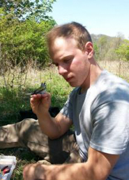 John Jones in the field holding a bird