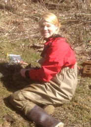 Elyse Russing dressed in waders in the field