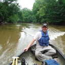Mike Gangloff in a boat on a river